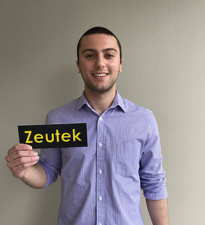 Michael Crapis holding Zeutek nameplate